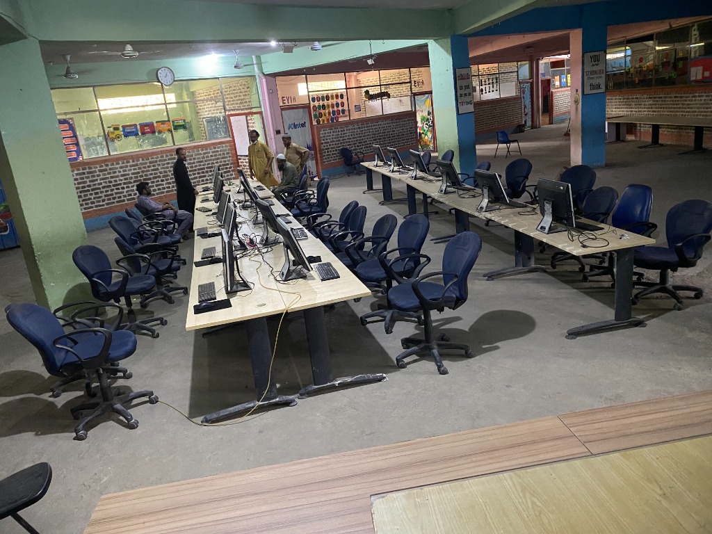 Overview of computer lab workstations and faculty at AIMS